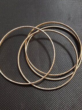 Four Gold-Tone Bangle-Bracelets